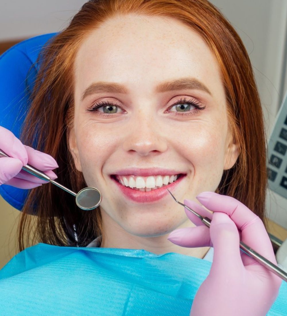 portrait-of-an-attractive-smiling-redhaired-ginger-customer-girl-in-a-dental-chair.jpg